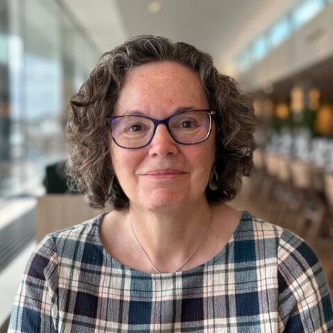A head-and-shoulders photo of Julie Glanville smiling at the camera.